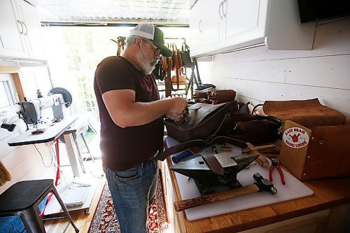 JOHN WOODS / WINNIPEG FREE PRESS
Chuck Allen, owner of Earth & Hide, a home-based pottery and leather works business, is photographed as he works on his product Monday, June 14, 2021. 

Reporter: Sanderson