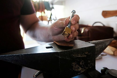 JOHN WOODS / WINNIPEG FREE PRESS
Chuck Allen, owner of Earth & Hide, a home-based pottery and leather works business, is photographed as he works on his product Monday, June 14, 2021. 

Reporter: Sanderson