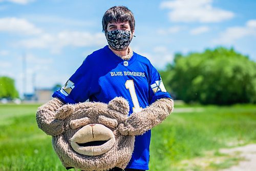 MIKAELA MACKENZIE / WINNIPEG FREE PRESS

Sean Schmatkow, aka Bomber Fan Ted, poses for a portrait in his fan gear at his home in Ste. Anne on Tuesday, June 15, 2021. For Taylor story.
Winnipeg Free Press 2021.