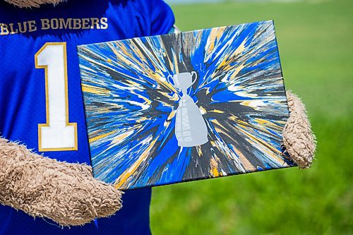 MIKAELA MACKENZIE / WINNIPEG FREE PRESS

Sean Schmatkow, aka Bomber Fan Ted, poses for a portrait in his fan gear at his home in Ste. Anne on Tuesday, June 15, 2021. For Taylor story.
Winnipeg Free Press 2021.