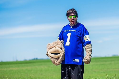 MIKAELA MACKENZIE / WINNIPEG FREE PRESS

Sean Schmatkow, aka Bomber Fan Ted, poses for a portrait in his fan gear at his home in Ste. Anne on Tuesday, June 15, 2021. For Taylor story.
Winnipeg Free Press 2021.