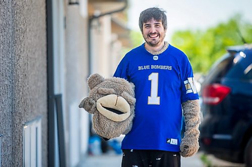 MIKAELA MACKENZIE / WINNIPEG FREE PRESS

Sean Schmatkow, aka Bomber Fan Ted, poses for a portrait in his fan gear at his home in Ste. Anne on Tuesday, June 15, 2021. For Taylor story.
Winnipeg Free Press 2021.