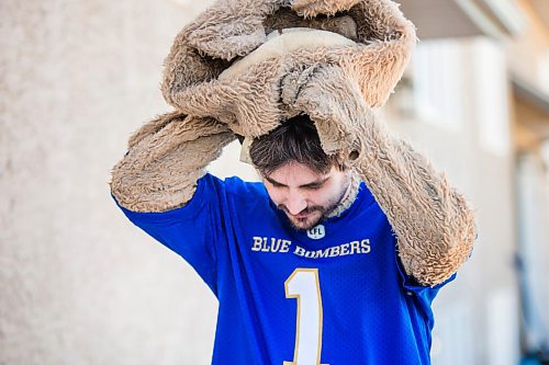 MIKAELA MACKENZIE / WINNIPEG FREE PRESS

Sean Schmatkow, aka Bomber Fan Ted, poses for a portrait in his fan gear at his home in Ste. Anne on Tuesday, June 15, 2021. For Taylor story.
Winnipeg Free Press 2021.