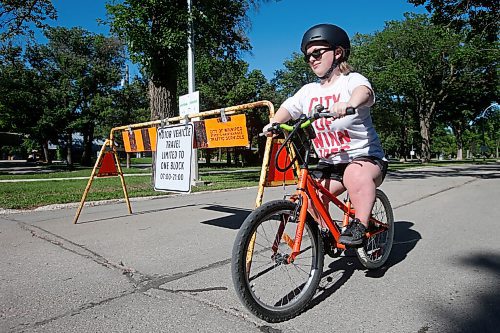 JOHN WOODS / WINNIPEG FREE PRESS
Sarah Manteuffel, who has dwarfism and identifies as disabled, is photographed on  Wellington Crescent Tuesday, June 15, 2021. Manteuffel finds it easier to bike on the open street as a person with a disability. Some residents are complaining that the program is leading to more traffic on Academy Road and prompting confrontations between drivers and pedestrians.

Reporter: Rutgers