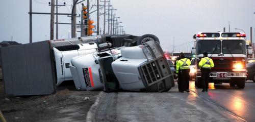 BORIS.MINKEVICH@FREEPRESS.MB.CA  100318 BORIS MINKEVICH / WINNIPEG FREE PRESS A semi flipped over on Lagimodiere near Bishop Grandon Blvd.