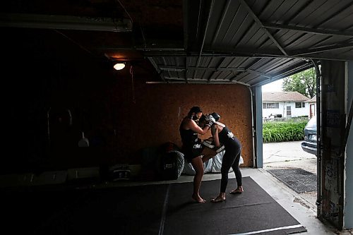 JOHN WOODS / WINNIPEG FREE PRESS
Ashley Viner, left, Muay Thai athlete who is ranked first in the Canadian welterweight division, trains with her cousin and coach, 2-time Canadian champion Trisha Sammons in Sammons garage Wednesday, June 16, 2021. 

Reporter: Katz