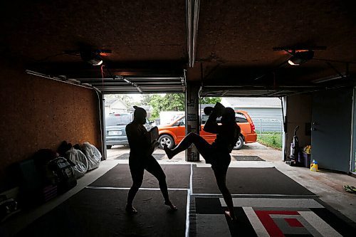 JOHN WOODS / WINNIPEG FREE PRESS
Ashley Viner, right, Muay Thai athlete who is ranked first in the Canadian welterweight division, trains with her cousin and coach, 2-time Canadian champion Trisha Sammons in Sammons garage Wednesday, June 16, 2021. 

Reporter: Katz