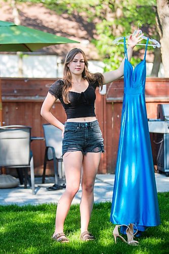 MIKAELA MACKENZIE / WINNIPEG FREE PRESS

Isabell Neves, who is graduating from Kelvin High School, poses for a portrait with her grad dress in Winnipeg on Wednesday, June 16, 2021. She set up the Instagram account @KelvinDresses2021 as a way to prevent people from showing up to grad in the same dress - now, it's a way for students to show off their finest since their grad dance isn't happening. For Jen Zoratti story.
Winnipeg Free Press 2021.