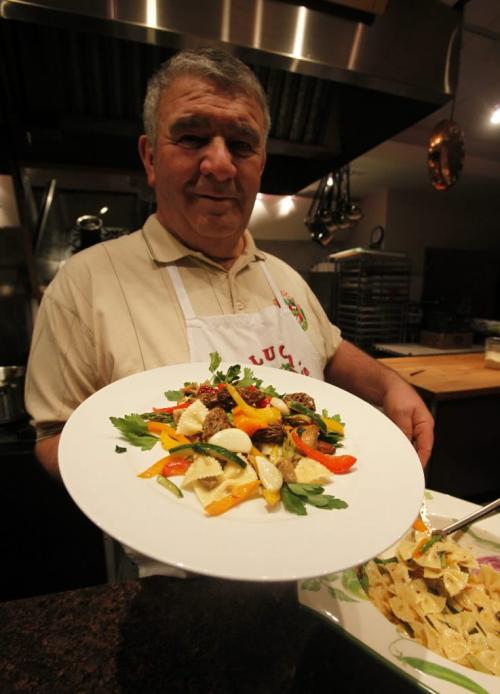 BORIS.MINKEVICH@FREEPRESS.MB.CA  100322 BORIS MINKEVICH / WINNIPEG FREE PRESS Tony de Luca  with a dish called Aglioae olioae vegetali.   Garlic oil and vegitables.