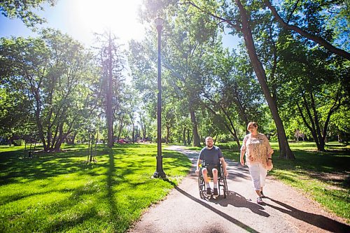 MIKAELA MACKENZIE / WINNIPEG FREE PRESS

Christine Schollenberg, outgoing executive director of the Childrens Rehabilitation Foundation, and Andrew Fenwick pose for a portrait in Munson Park in Winnipeg on Thursday, June 17, 2021. For --- story.
Winnipeg Free Press 2021.