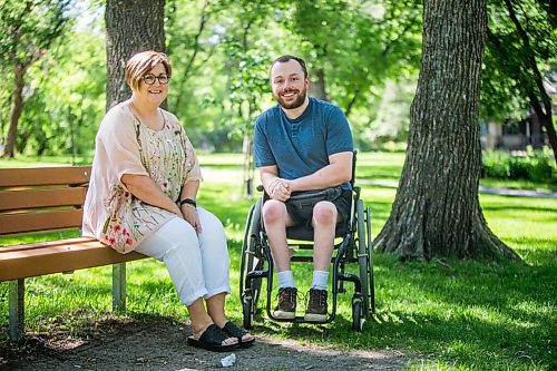 MIKAELA MACKENZIE / WINNIPEG FREE PRESS

Christine Schollenberg, outgoing executive director of the Childrens Rehabilitation Foundation, and Andrew Fenwick pose for a portrait in Munson Park in Winnipeg on Thursday, June 17, 2021. For --- story.
Winnipeg Free Press 2021.