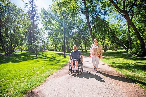 MIKAELA MACKENZIE / WINNIPEG FREE PRESS

Christine Schollenberg, outgoing executive director of the Childrens Rehabilitation Foundation, and Andrew Fenwick pose for a portrait in Munson Park in Winnipeg on Thursday, June 17, 2021. For --- story.
Winnipeg Free Press 2021.