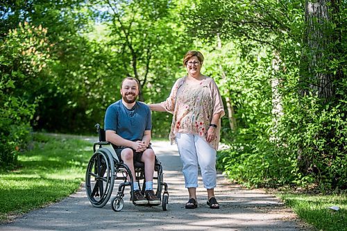 MIKAELA MACKENZIE / WINNIPEG FREE PRESS

Christine Schollenberg, outgoing executive director of the Childrens Rehabilitation Foundation, and Andrew Fenwick pose for a portrait in Munson Park in Winnipeg on Thursday, June 17, 2021. For --- story.
Winnipeg Free Press 2021.