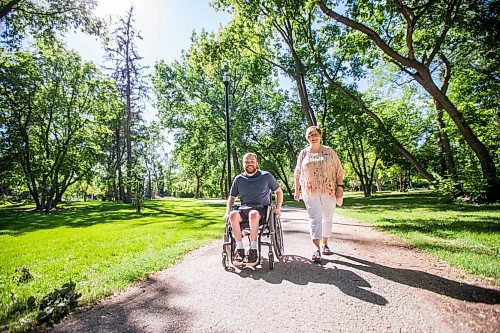 MIKAELA MACKENZIE / WINNIPEG FREE PRESS

Christine Schollenberg, outgoing executive director of the Childrens Rehabilitation Foundation, and Andrew Fenwick pose for a portrait in Munson Park in Winnipeg on Thursday, June 17, 2021. For --- story.
Winnipeg Free Press 2021.