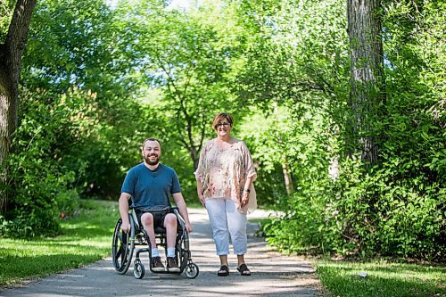 MIKAELA MACKENZIE / WINNIPEG FREE PRESS

Christine Schollenberg, outgoing executive director of the Childrens Rehabilitation Foundation, and Andrew Fenwick pose for a portrait in Munson Park in Winnipeg on Thursday, June 17, 2021. For --- story.
Winnipeg Free Press 2021.