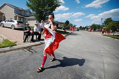 JOHN WOODS / WINNIPEG FREE PRESS
Winnipeg swimmer Kelsey Wog tears up as she is greeted by her neighbours Thursday, June 17, 2021. Residents of Wogs street gathered at the end of their driveways to wish her well as she heads off to the national swimming trials. 

Reporter: Sawatzki