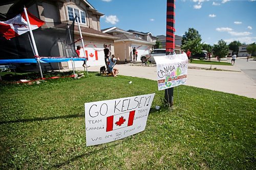 JOHN WOODS / WINNIPEG FREE PRESS
Neighbours signs wish well to Winnipeg swimmer Kelsey Wog Thursday, June 17, 2021. Residents of Wogs street gathered at the end of their driveways to wish her well as she heads off to the national swimming trials. 

Reporter: Sawatzki