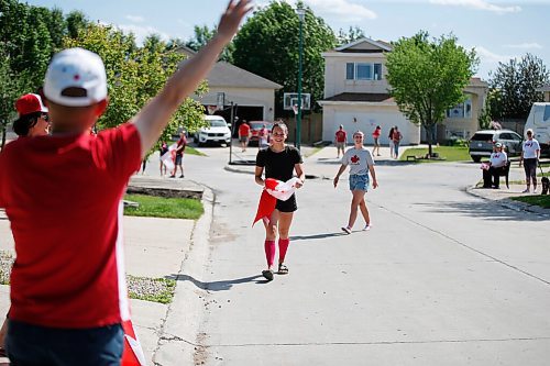 JOHN WOODS / WINNIPEG FREE PRESS
Winnipeg swimmer Kelsey Wog is greeted by her neighbours Thursday, June 17, 2021. Residents of Wogs street gathered at the end of their driveways to wish her well as she heads off to the national swimming trials. 

Reporter: Sawatzki