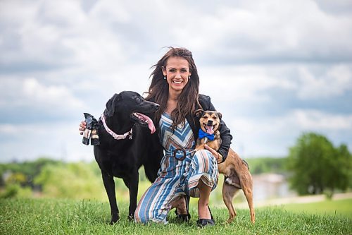 MIKAELA MACKENZIE / WINNIPEG FREE PRESS

Sierra Lathlin, owner of Barkery Dog Treats, poses for a portrait at Westview Park with her dogs, Anna (left) and Hilti, in Winnipeg on Friday, June 18, 2021. For Dave Sanderson story.
Winnipeg Free Press 2021.