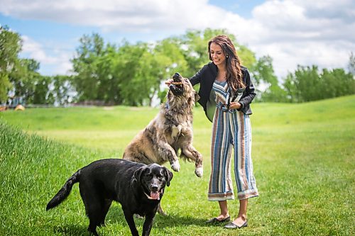 MIKAELA MACKENZIE / WINNIPEG FREE PRESS

Sierra Lathlin, owner of Barkery Dog Treats, poses for a portrait at Westview Park with her dogs, Anna (left) and Rocky, in Winnipeg on Friday, June 18, 2021. For Dave Sanderson story.
Winnipeg Free Press 2021.