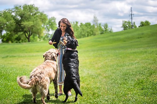 MIKAELA MACKENZIE / WINNIPEG FREE PRESS

Sierra Lathlin, owner of Barkery Dog Treats, poses for a portrait at Westview Park with her dogs, Rocky and Anna, in Winnipeg on Friday, June 18, 2021. For Dave Sanderson story.
Winnipeg Free Press 2021.