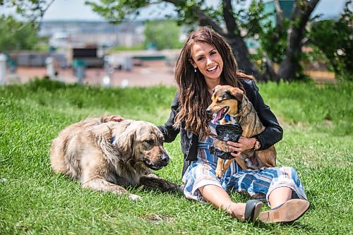 MIKAELA MACKENZIE / WINNIPEG FREE PRESS

Sierra Lathlin, owner of Barkery Dog Treats, poses for a portrait at Westview Park with her dogs, Rocky and Hilti, in Winnipeg on Friday, June 18, 2021. For Dave Sanderson story.
Winnipeg Free Press 2021.