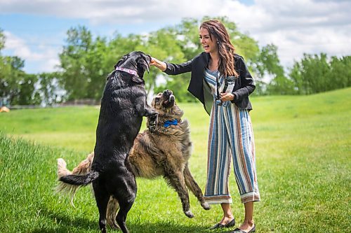 MIKAELA MACKENZIE / WINNIPEG FREE PRESS

Sierra Lathlin, owner of Barkery Dog Treats, poses for a portrait at Westview Park with her dogs, Anna (left) and Rocky, in Winnipeg on Friday, June 18, 2021. For Dave Sanderson story.
Winnipeg Free Press 2021.