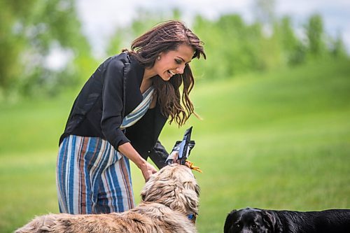 MIKAELA MACKENZIE / WINNIPEG FREE PRESS

Sierra Lathlin, owner of Barkery Dog Treats, poses for a portrait at Westview Park with her dogs, Rocky and Anna, in Winnipeg on Friday, June 18, 2021. For Dave Sanderson story.
Winnipeg Free Press 2021.