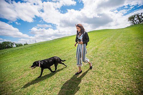 MIKAELA MACKENZIE / WINNIPEG FREE PRESS

Sierra Lathlin, owner of Barkery Dog Treats, poses for a portrait at Westview Park with her dog, Anna, in Winnipeg on Friday, June 18, 2021. For Dave Sanderson story.
Winnipeg Free Press 2021.