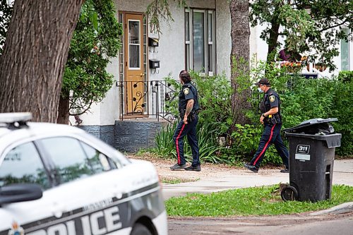 Daniel Crump / Winnipeg Free Press. Police officers canvas on Burrows avenue after a 12-year-old youth was fatally stabbed Friday evening. June 19, 2021.