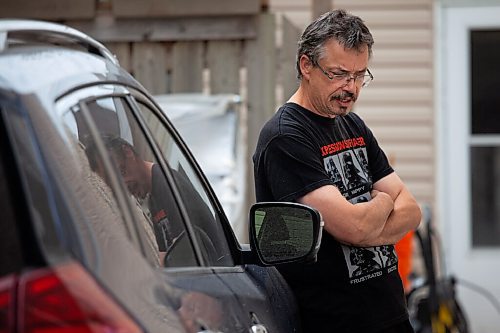 Daniel Crump / Winnipeg Free Press. Michael Bucci lives on Burrows Avenue with his son, Spencer (not pictured). Both were witnesses to the aftermath of a fatal stabbing of a 12-year-old youth that took place on the sidewalk in front of their house Friday evening. June 19, 2021.