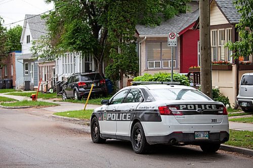 Daniel Crump / Winnipeg Free Press. A police cruiser is parked on Burrows avenue near the spot where a 12-year-old youth was fatally stabbed Friday evening. June 19, 2021.
