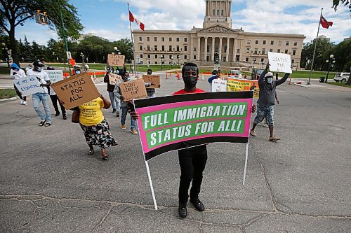 JOHN WOODS / WINNIPEG FREE PRESS
Winnipeg immigration and refugee groups gathered at the Manitoba Legislature and participated in a drive-by rally at the Canadian Museum for Human Rights Sunday, June 20, 2021. The group gathered for improved immigration rights.

Reporter: Standup