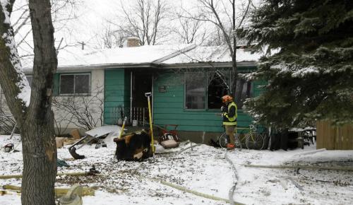 MIKE.DEAL@FREEPRESS.MB.CA 100324 - Wednesday, March 24th, 2010 A lone occupant of the house at 520 Hazel Dell Ave. was taken to hospital with unknown injuries from a fire according to Garry Pinette a Fire Chief (not in photo) at the scene. Fire Safety Officer inspect damage. MIKE DEAL / WINNIPEG FREE PRESS