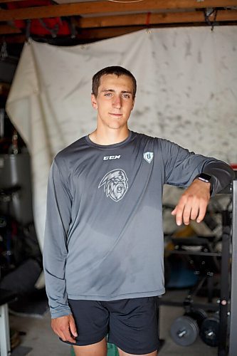 MIKE DEAL / WINNIPEG FREE PRESS
NHL draft prospect Carson Lambos works out in his home gym, the so-called Gritty Garage Monday morning.
See Mike Sawatzky story 
210621 - Monday, June 21, 2021.