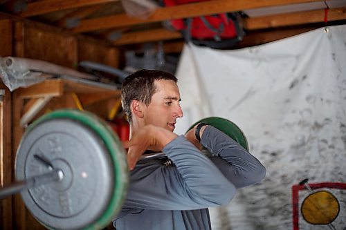 MIKE DEAL / WINNIPEG FREE PRESS
NHL draft prospect Carson Lambos works out in his home gym, the so-called Gritty Garage Monday morning.
See Mike Sawatzky story 
210621 - Monday, June 21, 2021.