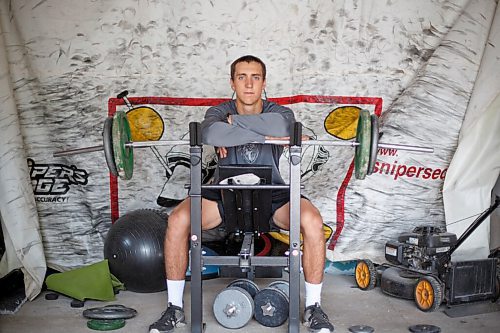 MIKE DEAL / WINNIPEG FREE PRESS
NHL draft prospect Carson Lambos works out in his home gym, the so-called Gritty Garage Monday morning.
See Mike Sawatzky story 
210621 - Monday, June 21, 2021.