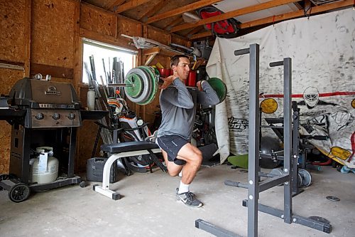 MIKE DEAL / WINNIPEG FREE PRESS
NHL draft prospect Carson Lambos works out in his home gym, the so-called Gritty Garage Monday morning.
See Mike Sawatzky story 
210621 - Monday, June 21, 2021.