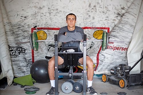 MIKE DEAL / WINNIPEG FREE PRESS
NHL draft prospect Carson Lambos works out in his home gym, the so-called Gritty Garage Monday morning.
See Mike Sawatzky story 
210621 - Monday, June 21, 2021.