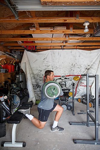 MIKE DEAL / WINNIPEG FREE PRESS
NHL draft prospect Carson Lambos works out in his home gym, the so-called Gritty Garage Monday morning.
See Mike Sawatzky story 
210621 - Monday, June 21, 2021.