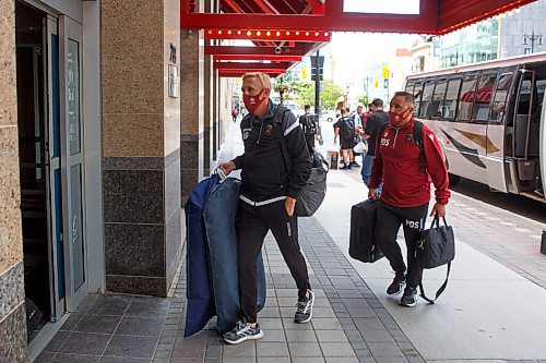 MIKE DEAL / WINNIPEG FREE PRESS
Head coach Rob Gale and goalie coach Patrick Di Stefani enter the Radisson Hotel downtown.
Members of the Valour FC arrive at the Raddison Hotel on Portage Avenue Monday afternoon where the Canadian Premiere League bubble has been set up.
See Taylor Allen story 
210621 - Monday, June 21, 2021.