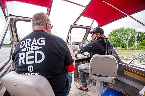 MIKAELA MACKENZIE / WINNIPEG FREE PRESS

Doug Park (right) and Mitch Bourbonniere take the boat out on the river on the 2021 launch of Drag the Red, a search for missing and murdered, with a new boat (donated by Unifor) on the Red River near the Redwood Bridge in Winnipeg on Monday, June 21, 2021. Standup.
Winnipeg Free Press 2021.