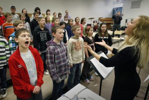 MIKE.DEAL@FREEPRESS.MB.CA 100325 - Thursday, March 25th, 2010 Rosemarie Todaschuk (right) directs students from the English-Ukrainian bilingual program at R.F. Morrison school during a recording session for a CD of Ukrainian folk songs to celebrate the 30th Anniversary of the English-Ukrainian bilingual project. See Nick Martin story MIKE DEAL / WINNIPEG FREE PRESS
