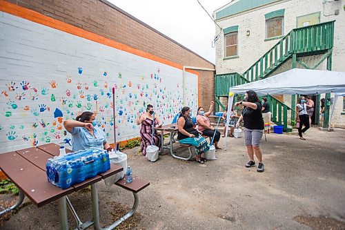 MIKAELA MACKENZIE / WINNIPEG FREE PRESS

Folks move their arms while in the waiting period after getting their Moderna shots at the pop-up vaccine clinic at the North End Women's Centre in Winnipeg on Wednesday, June 23, 2021. Standup.
Winnipeg Free Press 2021.