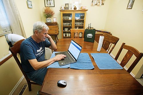 JOHN WOODS / WINNIPEG FREE PRESS
Doug Lang, who looks at the Shared Health vaccine site which is missing a record of his wifes second vaccine, is photographed in his home in Winnipeg Wednesday, June 23, 2021.

Reporter:Da Silva