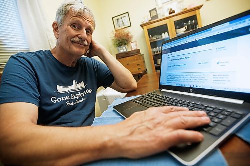 JOHN WOODS / WINNIPEG FREE PRESS
Doug Lang, who looks at the Shared Health vaccine site which is missing a record of his wifes second vaccine, is photographed in his home in Winnipeg Wednesday, June 23, 2021.

Reporter:Da Silva