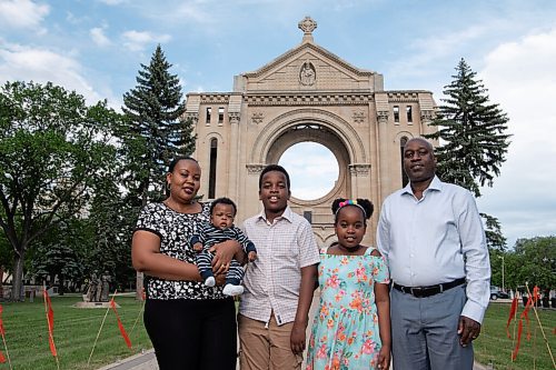 ALEX LUPUL / WINNIPEG FREE PRESS  

From left, Gloriose Nsabimana, Ange-Karel Ndeba Ishimwe, Ange-Axel Ndeba Iradukunda, Ange Kristy Ndeba Irakoze and Claude Marcel Ndeba pose for a portrait at the Saint-Boniface Cathedral in Winnipeg on Wednesday, June 23, 2021. For the family, being able to worship in French at the Cathedral is very important to them.