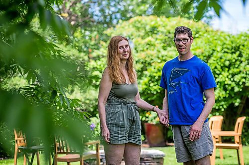 MIKAELA MACKENZIE / WINNIPEG FREE PRESS

Karla Berbrayer and her son, Micah Kraut, pose for a photo in Karla's backyard in Winnipeg on Thursday, June 24, 2021. She's unhappy that the reopening plan doesn't include day centres for people like him. For Malak story.
Winnipeg Free Press 2021.