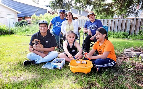 RUTH BONNEVILLE / WINNIPEG FREE PRESS

49.8 VIRUS THREE FAMILIES: following three families in 3 different types of schooling. 
 
Group photo of the two Homeschooling families: Anna and Jason Parenteau (back left) and their sons: Carter in Grade 4 (orange shirt) and Josiah in Grade 12 (black shirt), and cousins - Dawnis Kennedy and Grade 3 son Kenny Kennedy (centre) at The Parenteau family's home in Silver Heights, in their backyard.  After months of being apart these two families, that are in the same bubble, get together for a group photo. 

Story: following three families  a homeschooling family, remote learning family and in-class instruction family  to document their learning curves during the pandemic. The last (fourth) edition will run July 3.

June 24,, 2021

