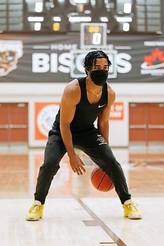 JOHN WOODS / WINNIPEG FREE PRESS
Keiran Zziwa, a U of MB Bison basketball player, throws some baskets at the university in Winnipeg Wednesday, June 23, 2021. Zziwa is heading to Morocco to play for Uganda at the Afro Basketball qualifier.

Reporter: Sawatzky